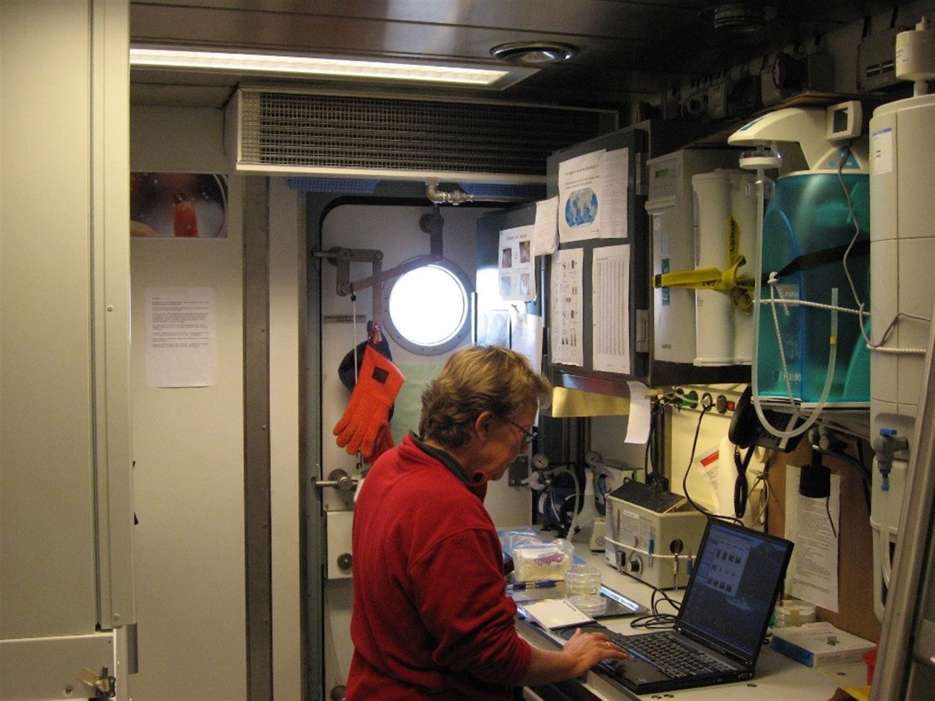 Lab working in container three on the ship Vædderen