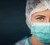 Protection against contagious disease, coronavirus. Female doctor wearing hygienic face surgical medical mask. Banner panorama medical staff preventive gear. Studio Photo, Black edit space